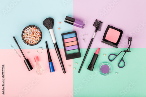 set of professional decorative cosmetics, makeup tools and accessory on colorful background. beauty and fashion concept. flat lay composition, top view