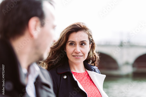 Couple alking on the riverside photo