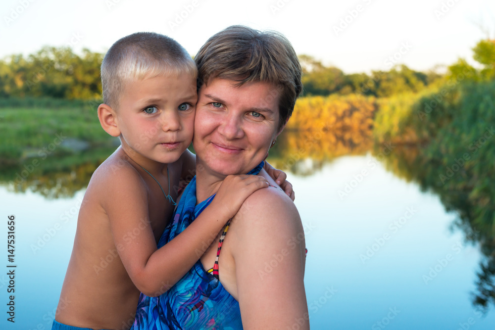 Happy mom hugs his young son Happy mom hugs his young son