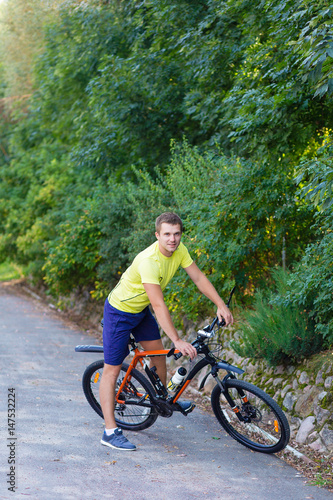 A young guy on a bike outdoors