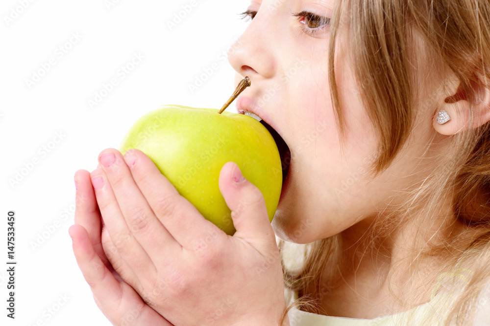 cute happy girl eating green apple isolated on white cute happy girl eating green apple isolated on white