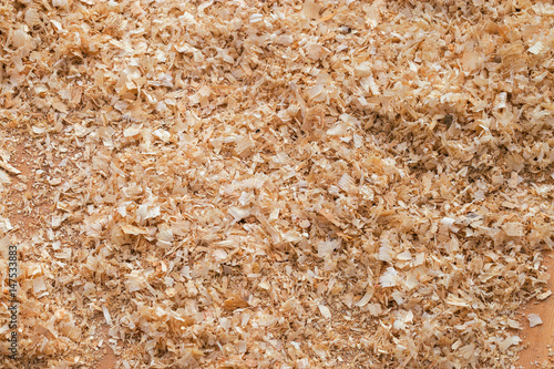 Background made from natural sawdust. Hardwood sawdust. Hardwood chips.