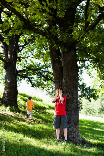 Two Boys Playing Hide and Seek photo