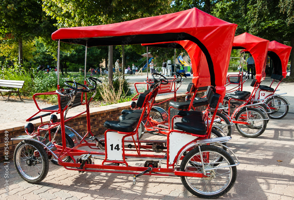 Red retro quad bikes in Parc floral 
(public park and botanical garden) in Paris (France)