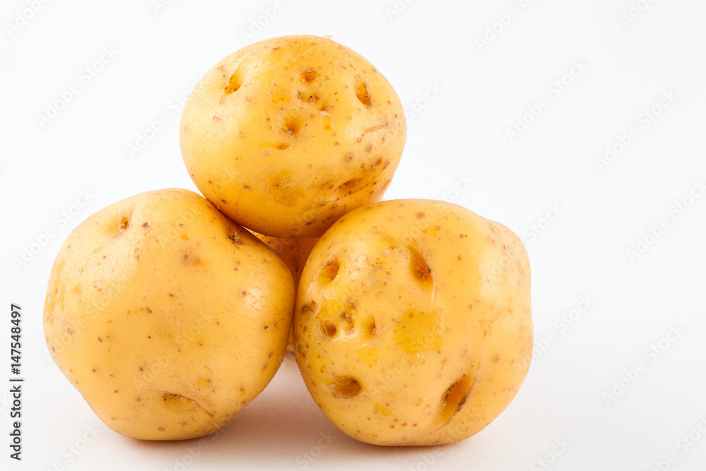 Yellow potato (Solanum phureja) isolated in white background Yellow potato (Solanum phureja) isolated in white background