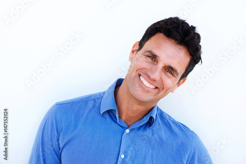 Close up smiling businessman against white background