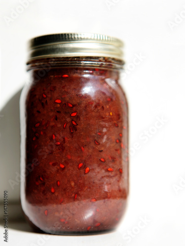 Jar of juneberry jam photo