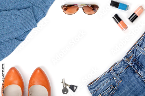 woman clothes and accessories set isolated on white background with copy space for your text top view. modern and casual outfit. fashion, shopping and business concept. blue and salmon colors