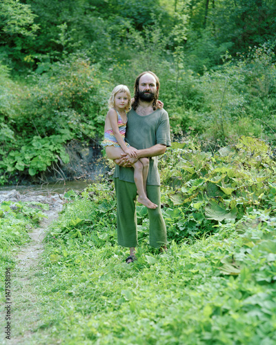 Father and daughter in a clearing, Nowica, Poland photo