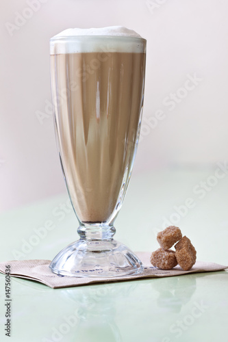 Cafe con leche with sugar lumps