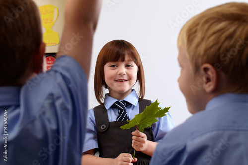 School girl doing a presentation to other classmates