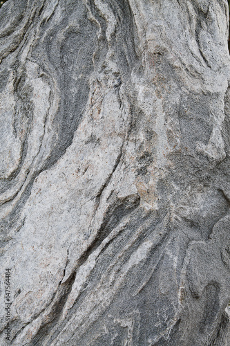 Texture of gray stone with stains closeup