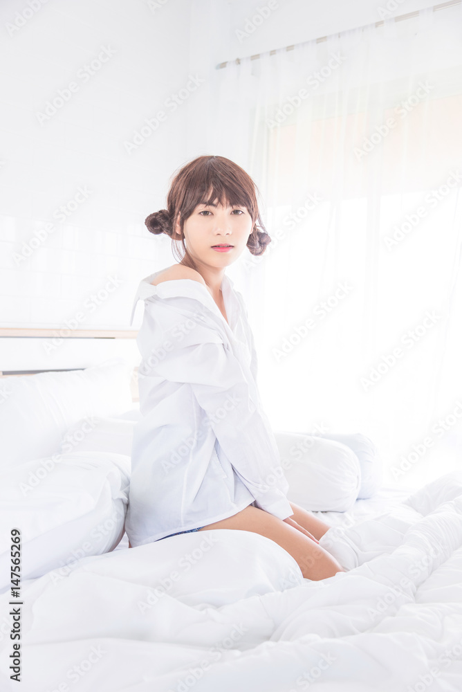 Beautiful asian boy sitting in bedroom Beautiful asian boy sitting in bedroom