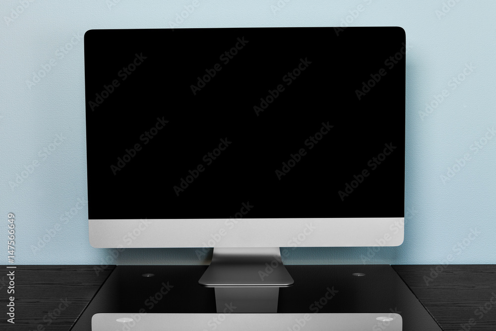 Fototapeta premium computer on a black wooden table in an office