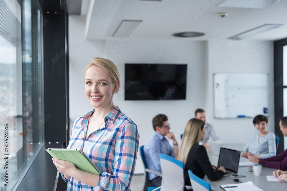 Pretty Businesswoman Using Tablet In Office Building by window Pretty Businesswoman Using Tablet In Office Building by window
