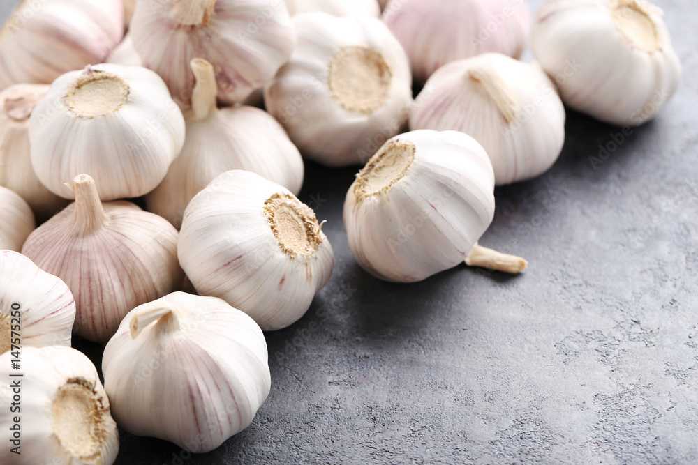 Garlic on the grey wooden table Garlic on the grey wooden table