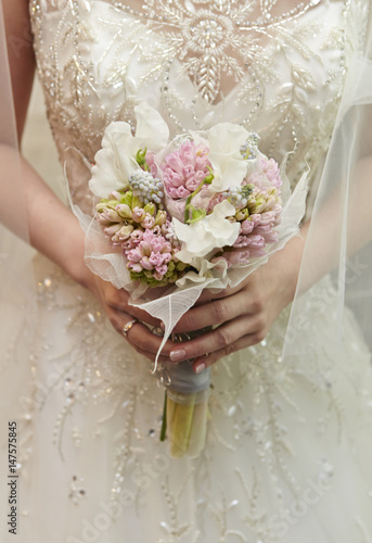 Bride holding wedding bouquet 