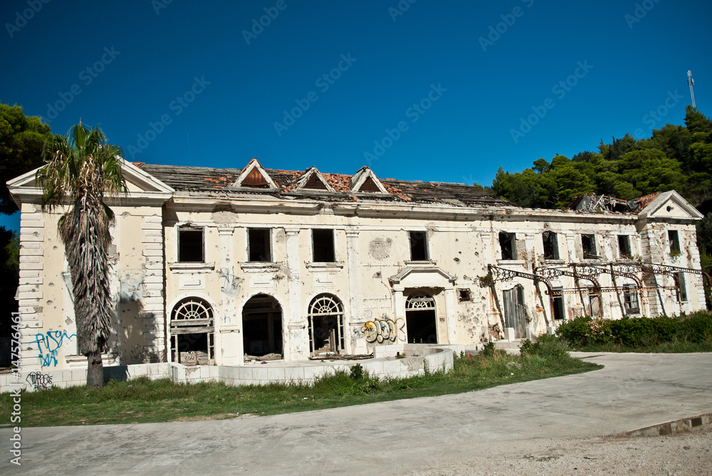 Abandoned dirty demolished building, one of hotels in Kupari complex near Dubrovnik city