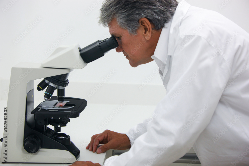 Scientist doing technical and chemical analysis of corn and soybean Scientist doing technical and chemical analysis of corn and soybean