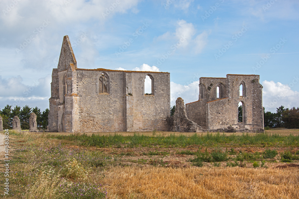 Ruined Cistercian abbey on the island Ile de Re against cloudy sky, France