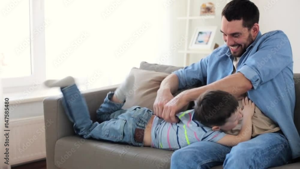 father with son playing and having fun at home father with son playing and having fun at home