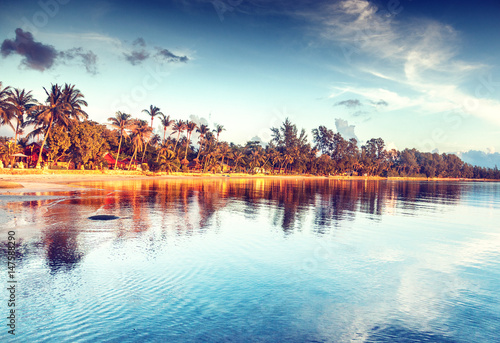 Photography Beautiful bright sunset on a tropical paradise beach