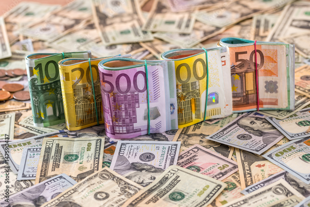 Obraz premium finance concept - many dollar and euro.
