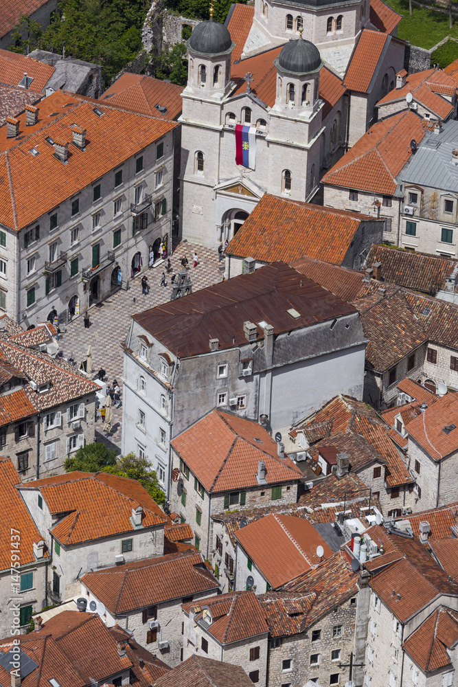 Bright tiled roofs of the houses in Kotor old town in Montenegro seen from above