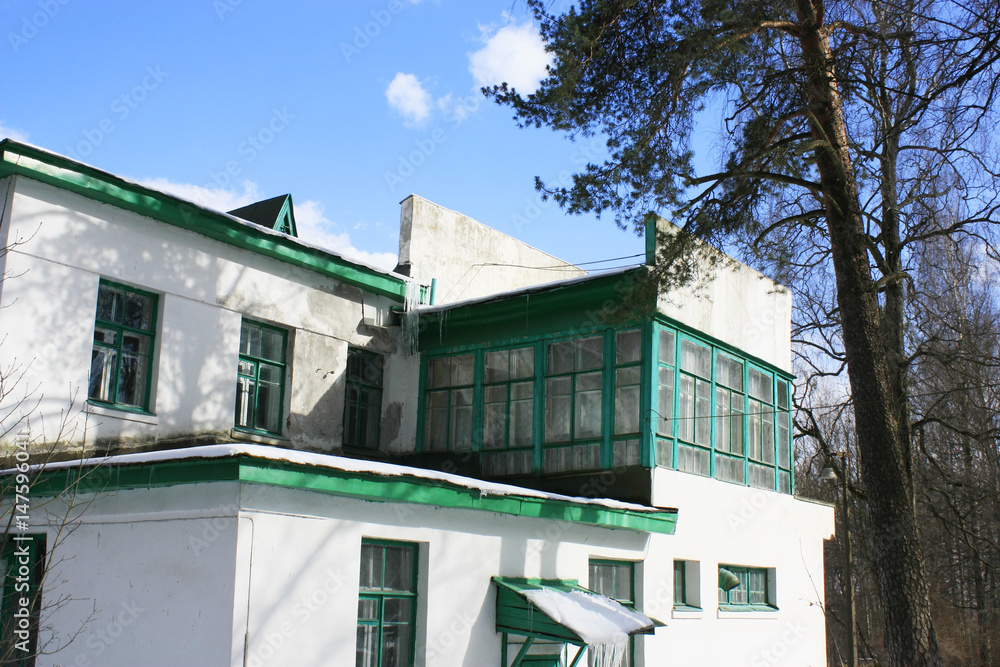 Old white brick stucco two-storey house