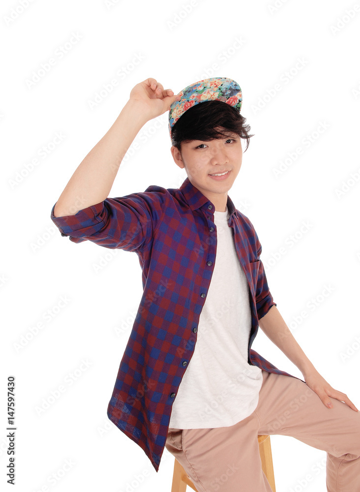 Handsome Asian man with cap. Handsome Asian man with cap.