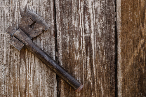 Ax on vintage wooden background