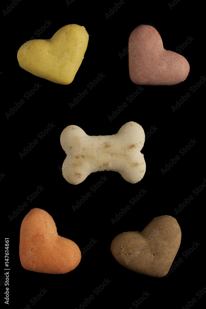 Obraz premium Dog cookies on a black background