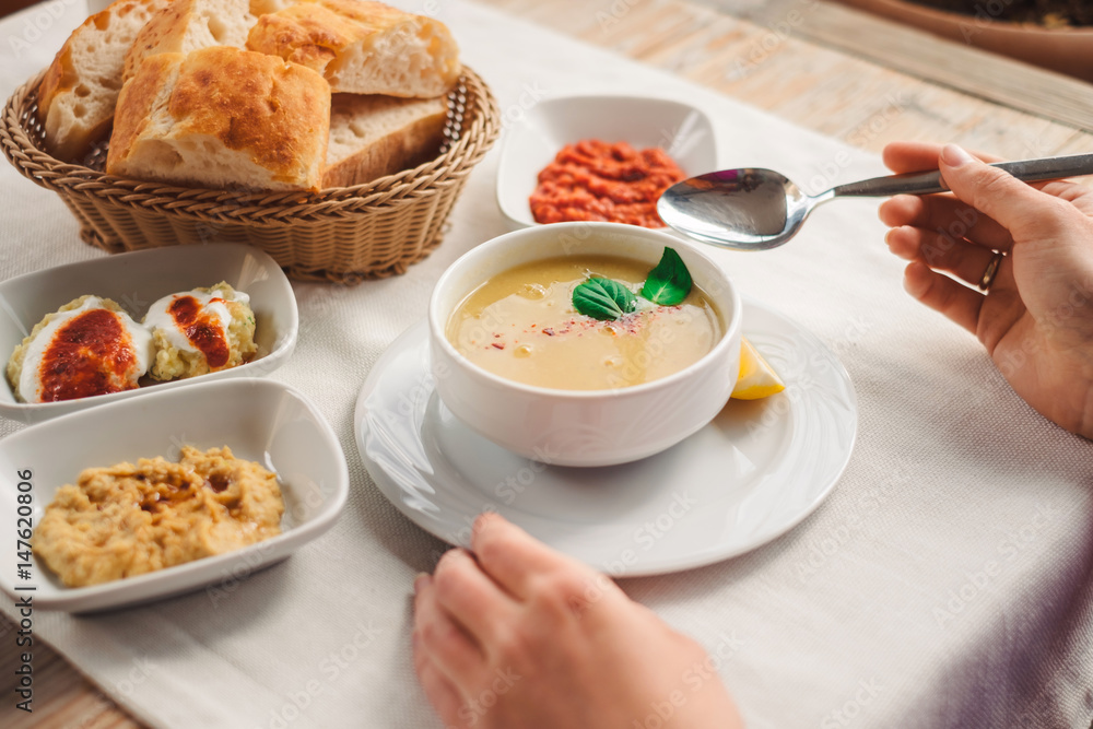 Woman eat traditional Cappadocia food from lentil soup Woman eat traditional Cappadocia food from lentil soup