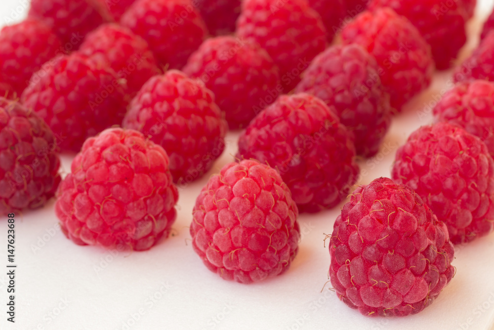 Raspberry on a white background close up Raspberry on a white background close up