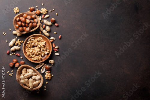 Various nuts on stone table