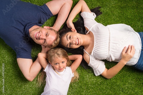 Family Laying In The Grass
