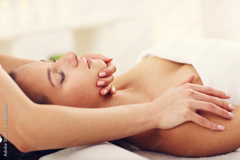 Beautiful woman getting massage in spa Beautiful woman getting massage in spa