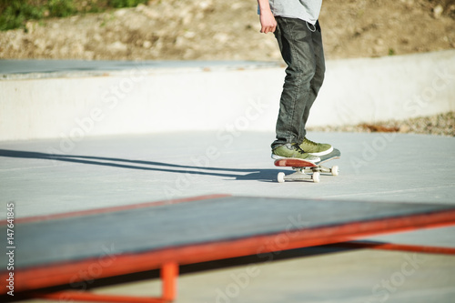 Close-up Skateboarder's legs skateboard on concrete. Skating On skateboard popular youth extreme sports