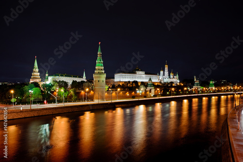 Moscow Kremlin at night. Embankment with car traffic view