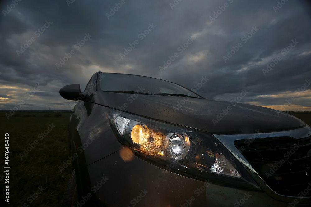 Fototapeta premium Сar on the road in the field