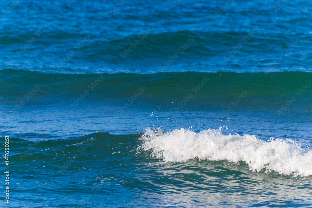 Small waves and blue sea