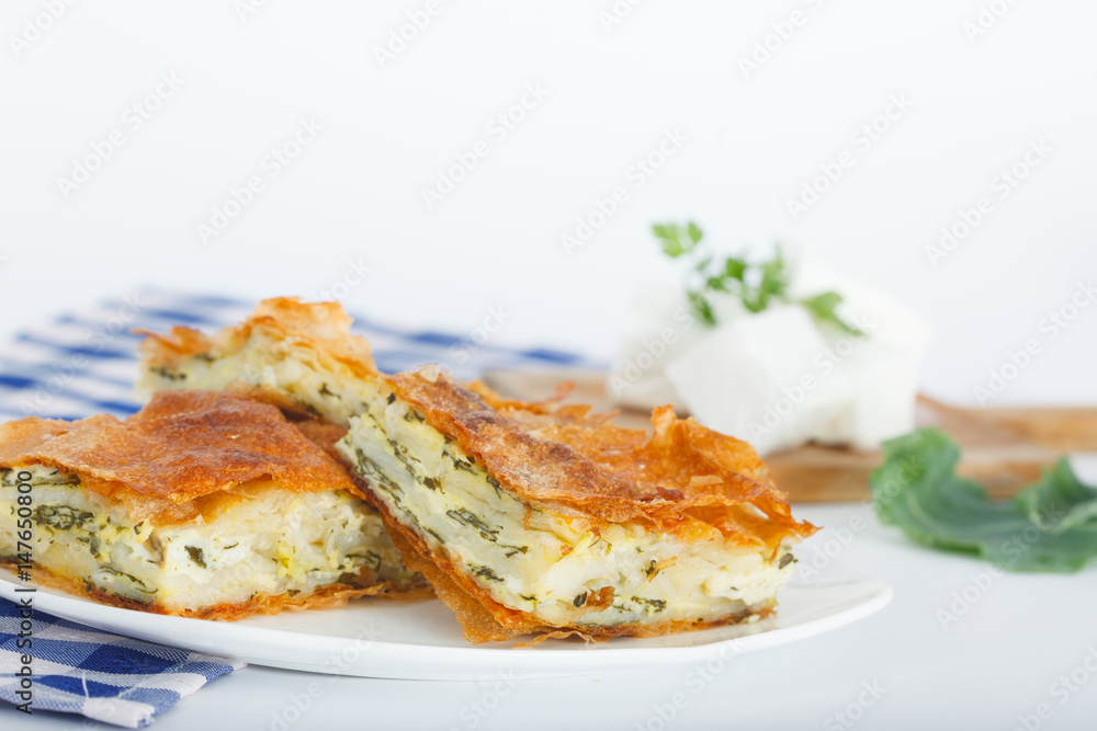 Plate of Freshly baked Serbian Traditional Zeljanica Spinach-cheese Pie slices
