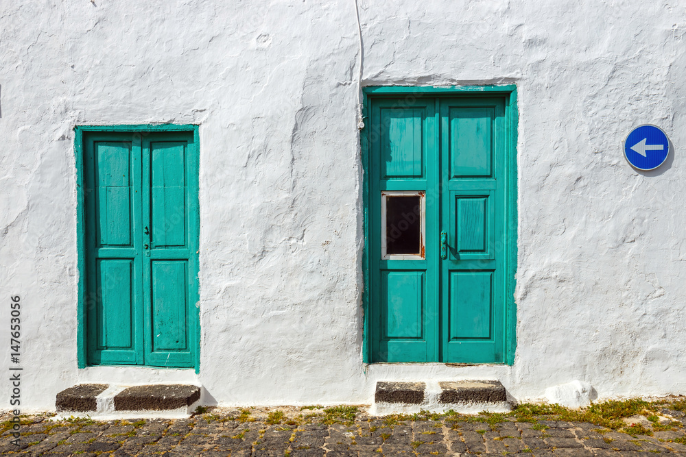 green door and window on white wall background green door and window on white wall background