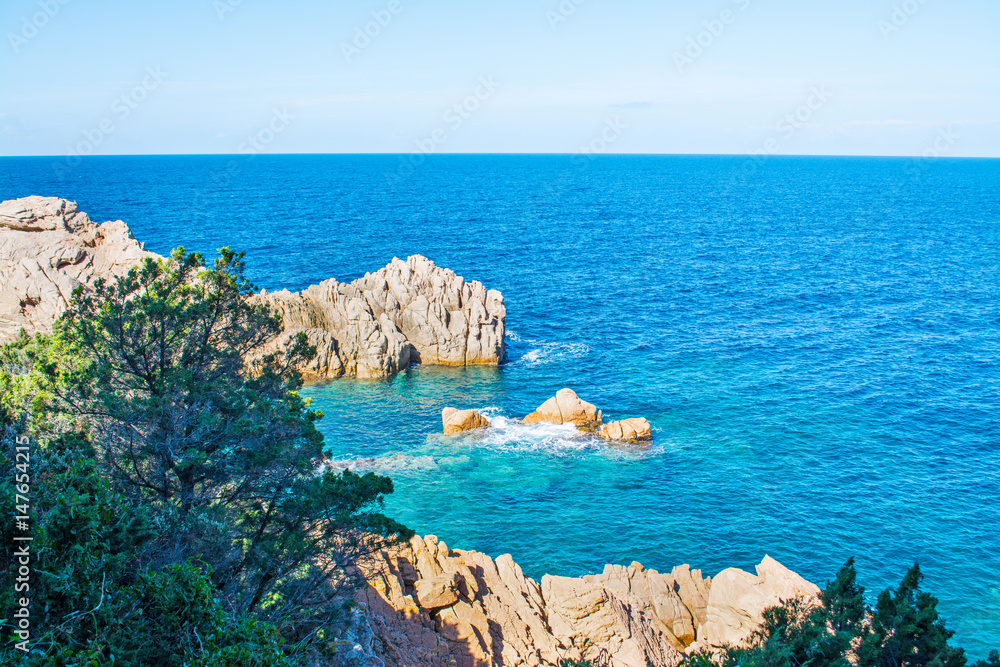Grey rocks and blue sea