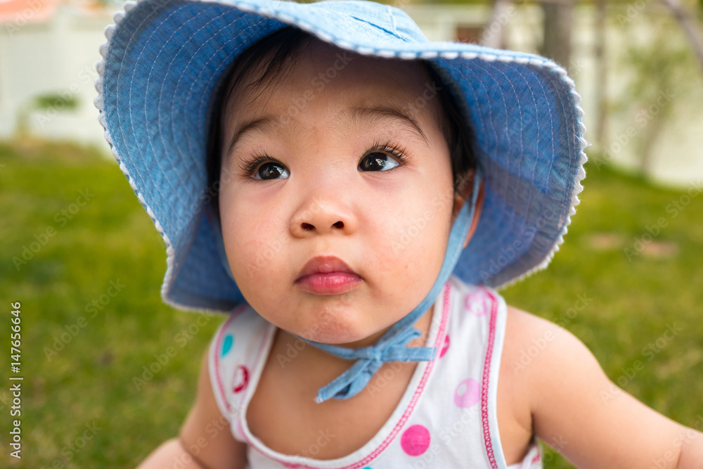 Close-up portrait child wearing hat looking up Close-up portrait child wearing hat looking up