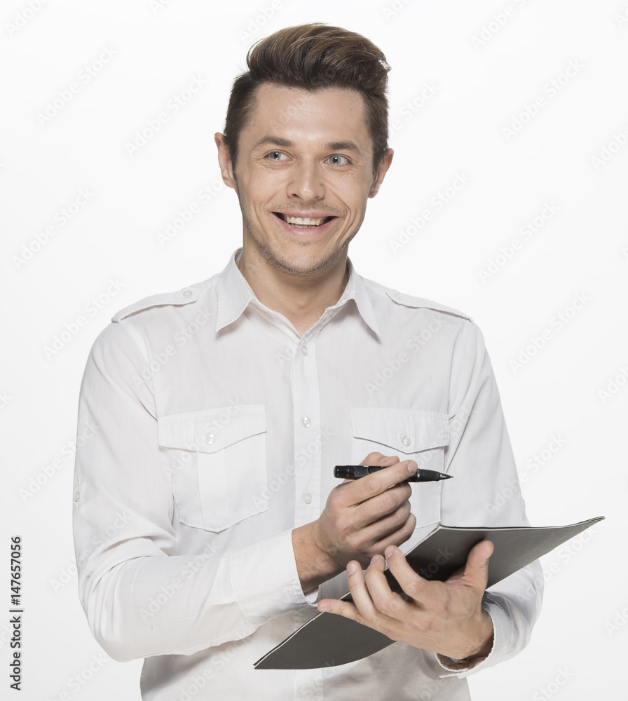Young man taking notes, isolated on white Young man taking notes, isolated on white