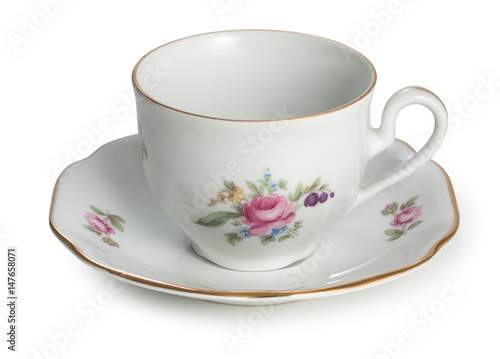 Vintage czech empty porcelain cup for coffee on saucer, old style rich decorated, isolated on a white background.