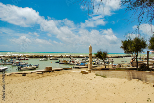 Punta Secca, Italy - June 02, 2010: A beautiful sunny day on the sicilian beach preferred by the inspector Montalbano