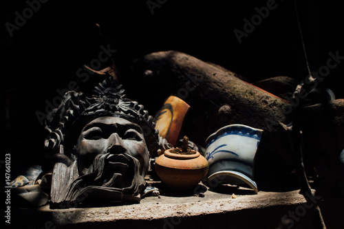 Asian cultural mask lia. Old, vintage in the archival dust.