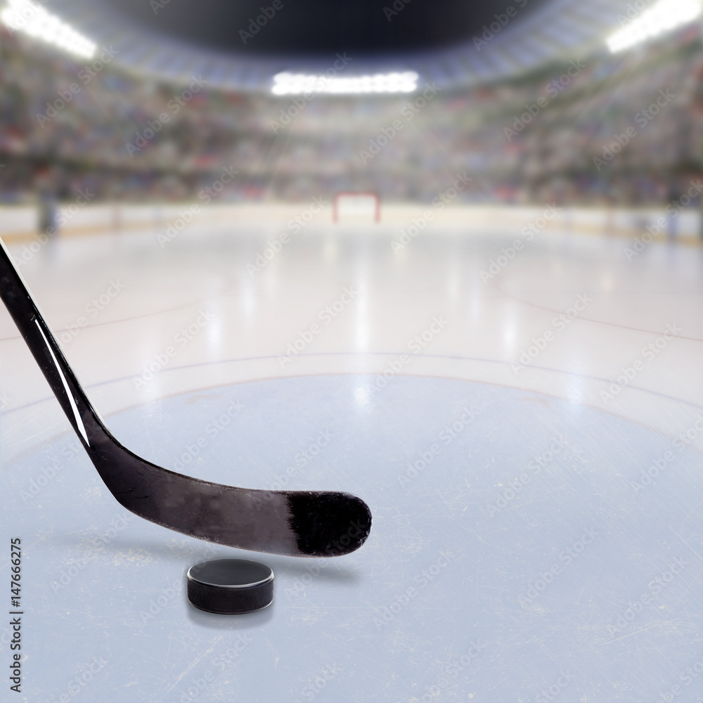 Fototapeta premium Hockey Stick and Puck on Ice of Crowded Arena